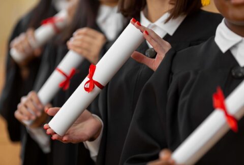 close-up-people-graduating-with-diplomas (1)